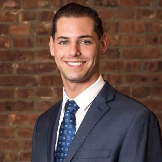 Dr. Brett Tave wearing a suit