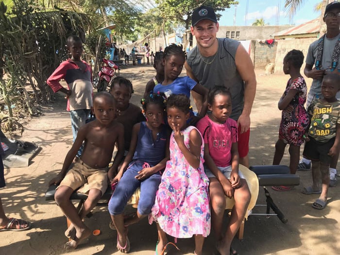 Dr. Brett Tave with children in haiti