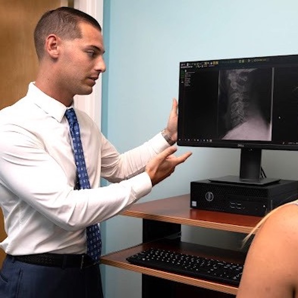 Dr. Brett Tave showing spine x-ray