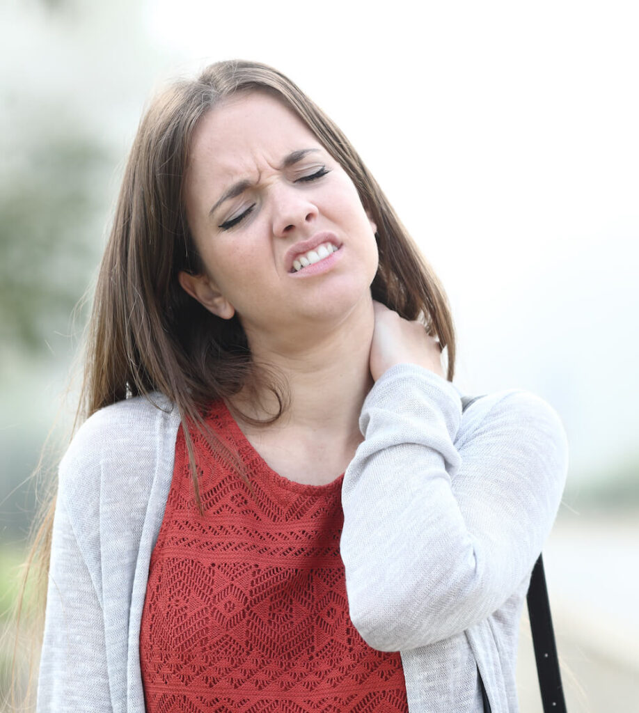 young woman wearing red shirt suffer from neck pain