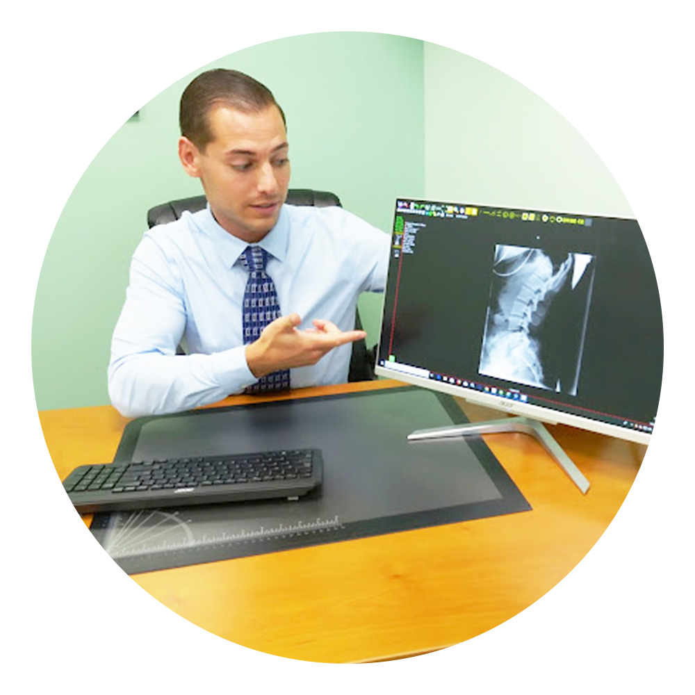 Chiropractor Reviewing X-Ray